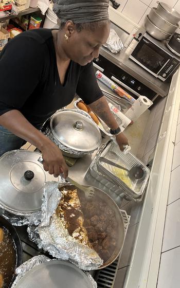 A person cooks Caribbean food at a restaurant in Bavaria.