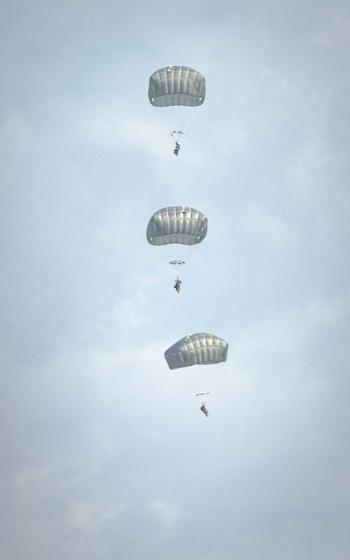 Paratroopers with the 173rd Airborne Brigade parachute near the Joint Multinational Readiness Center Hohenfels Training Area, Germany, for Exercise Saber Junction on Sept. 4, 2024. 