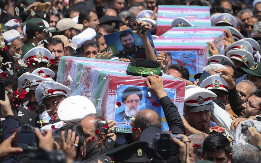 Flag-draped coffins of President Ebrahim Raisi and his companions who were killed in a helicopter crash on Sunday are carried during their funeral ceremony in the city of Mashhad, Iran, Thursday, May 23, 2024.