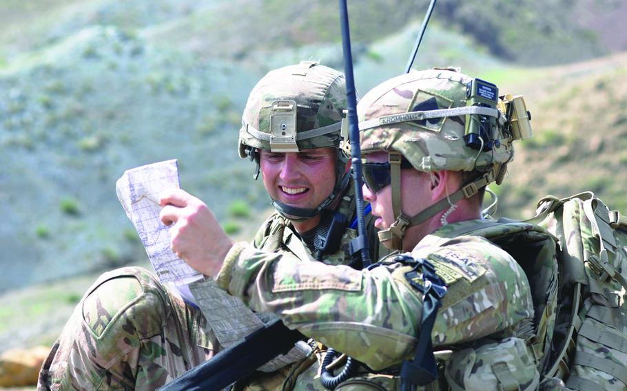 Easy Company platoon leader 1st Lt. James Kromhout, right, and Maj. Jason Sumner, a security force assistance team commander try to determine their position