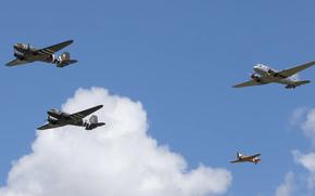 A Douglas C-47 Skytrain leads a formation flight over Wiesbaden Army Airfield during the 75th anniversary of the Berlin Airlift held on Lucius D. Clay Kaserne, Wiesbaden, Germany, June 15, 2024. The Douglas C-47 Skytrain was one of the aircraft used by the U.S. during the airlift but was later replaced by aircraft that could transport larger payloads.
