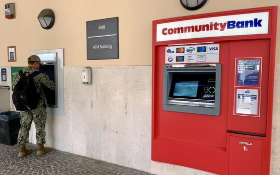 A sailor uses a Community Bank ATM at U.S. Naval Support Activity Naples in Italy on July 24, 2024. Starting Monday, service members and other customers of Community Bank no longer will have a U.S. currency option in the online bill payment system.