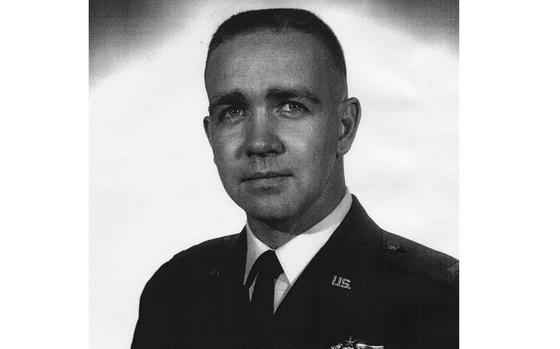 A black-and-white photo portrait of an Air Force pilot.