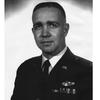 A black-and-white photo portrait of an Air Force pilot.