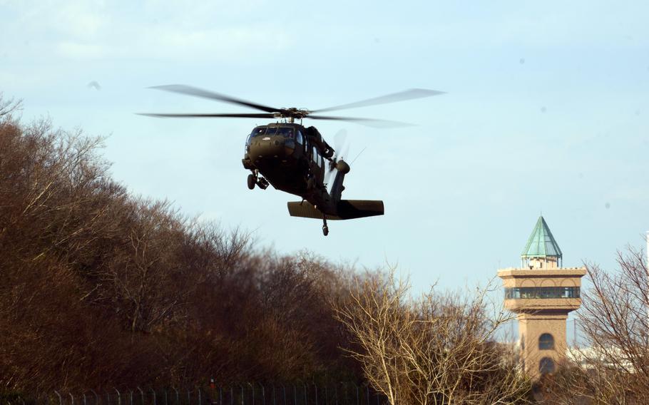 A Black Hawk helicopter takes off.