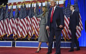 Former President Donald Trump, now president-elect, arriving at an election night watch party with Melania Trump and Barron Trump.