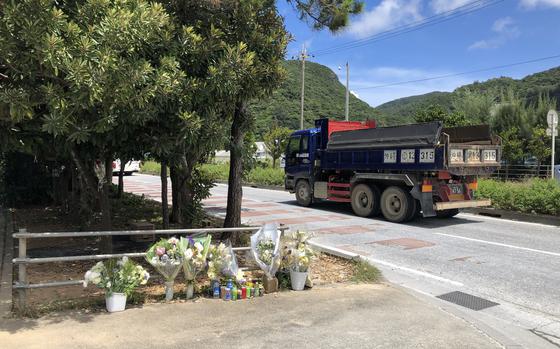 An informal memorial to a secrity guard struck and killed by a truck at Awa pier in Nago, Okinawa, Japan, as seen June 28, 2024