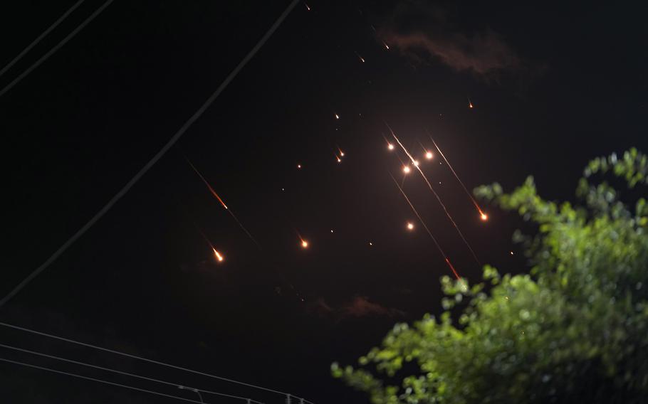 Missiles launched from Iran towards Israel streak across the night sky, Oct. 1, 2024.