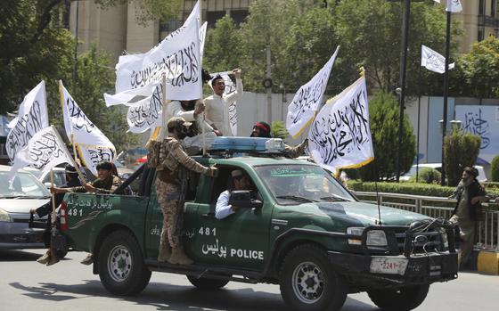 Taliban fighters celebrate the third anniversary of the withdrawal of US-led troops from Afghanistan, in Kabul, Afghanistan, Wednesday, Aug. 14, 2024. (AP Photo/Siddiqullah Alizai)