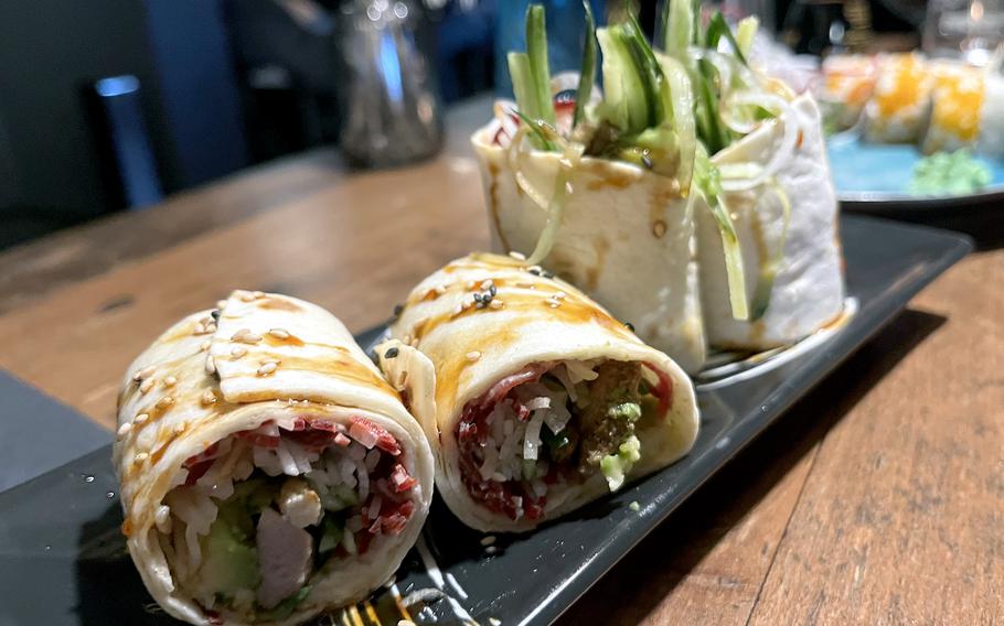 Kaiza's duck roll, seen here in Weiden, Germany, on June 14, 2024, features grilled duck strips, avocado, cucumber, radish and beet, topped with spicy mayo and teriyaki sauce in a soft tortilla.