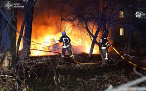 In this photo provided by the Ukrainian Emergency Service, firefighters extinguish the fire following a Russian rocket attack that hit a multi-storey apartment building in Sumy, Ukraine, Sunday, Nov. 17, 2024. (Ukrainian Emergency Service via AP)