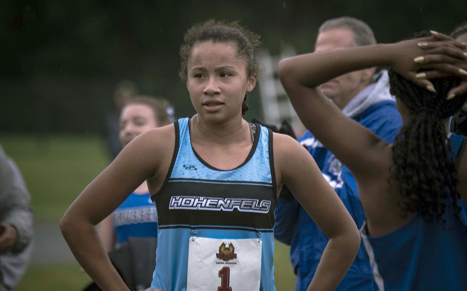 Hohenfels senior Jalissa Jobity watches as runners cross the finish line after finishing second in a cross country meet on Saturday, Sept. 14, 2024. 