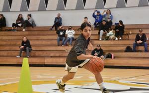 AFNORTH's Selah Skariah quickly navigates through a cone obstacle course during the skills competition of the DODEA-Europe Girls All-Star Basketball Game in Vicenza, Italy, on Saturday, Feb. 24, 2024.

Kent Harris/Stars and Stripes