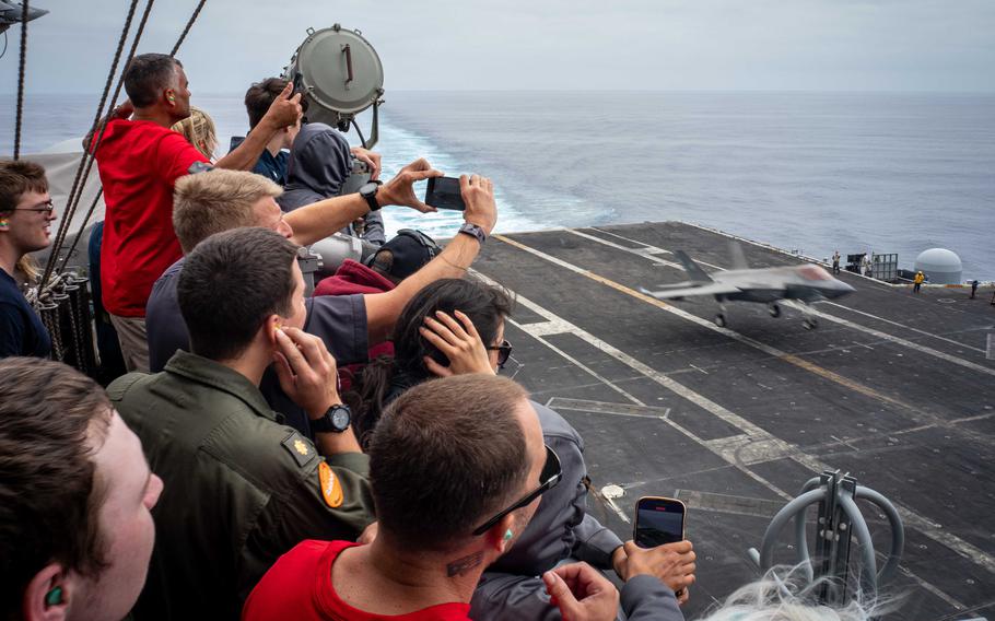 Sailors and their guests watch as an F-35C Lighting II, assigned to the “War Hawks” of Strike Fighter Squadron (VFA) 97, takes off from the flight deck aboard Nimitz-class aircraft carrier USS Carl Vinson (CVN 70) during an airpower demonstration while underway for a Family and Friends Day Cruise on Saturday, Aug. 17, 2024.