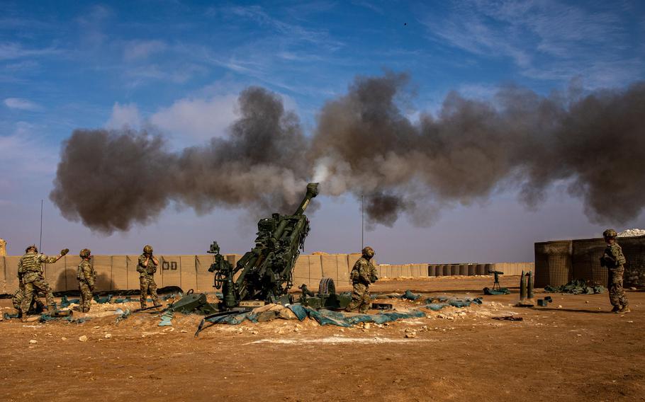 U.S. soldiers fire an M777 howitzer during an exercise in Syria.