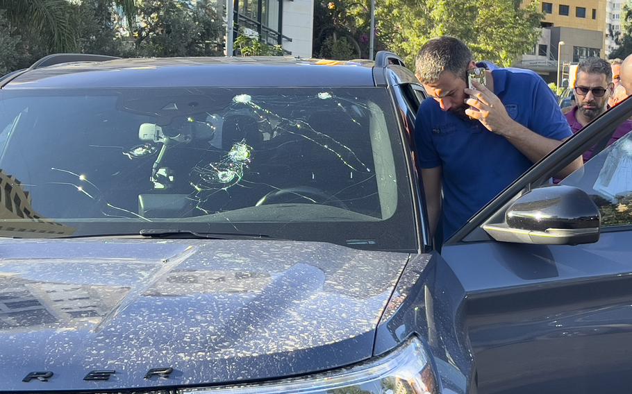 Police officers inspect a car inside of which a hand-held pager exploded in Beirut, Lebanon, on Sept. 17, 2024.