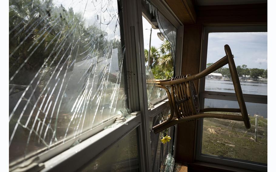 The storm forced furniture through a window at the home of Bobbi Pattison in Steinhatchee, Fla., on Aug. 31, 2023. 