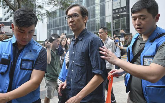 Chung Pui-kuen, the former chief editor of Hong Kong's now-shuttered outlet Stand News, leaves court after he was found guilty in a landmark sedition trial in Hong Kong on Aug. 29, 2024.