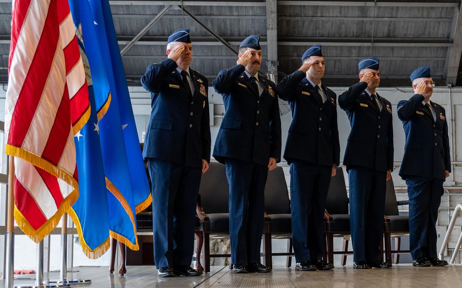 From left, U.S. Air Force Maj. Gen. Charles Bolton, 18th Air Force commander, Maj. Alex Grayson, Capt. Anthony Carella, Capt. John Squatrito, and Senior Airman Alex Fiscus, aircrew assigned to the 6th Air Refueling Wing, render a salute