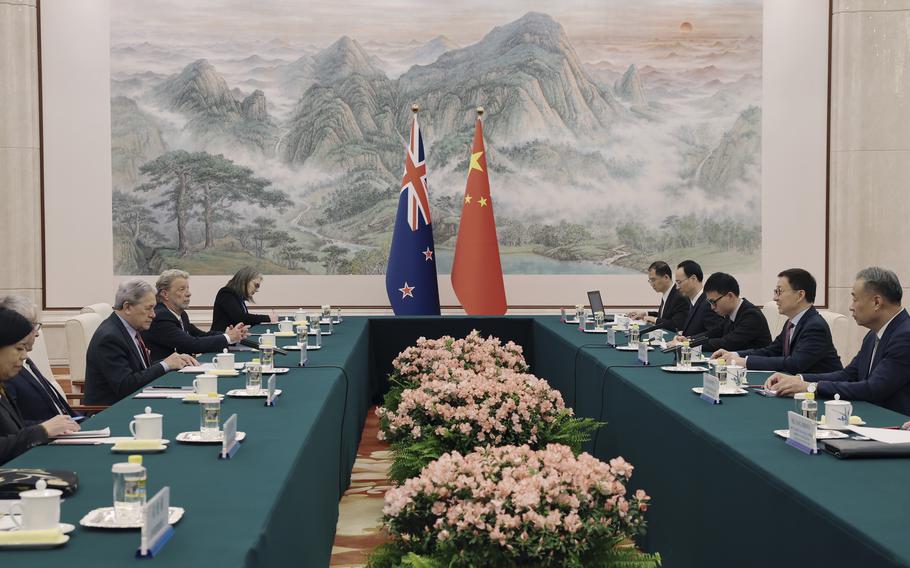 In this photo released by Xinhua News Agency, Chinese Vice President Han Zheng, second right, talks to visiting New Zealand Foreign Minister Winston Peters during a bilateral meeting in Beijing, Wednesday, Feb. 26, 2025.