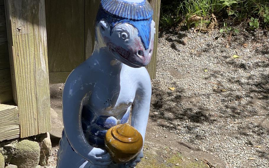 A statue of a kappa, Japan's most elusive mythical creature, sits near Kappabuchi Pool in Tono, a city in Iwate prefecture.  