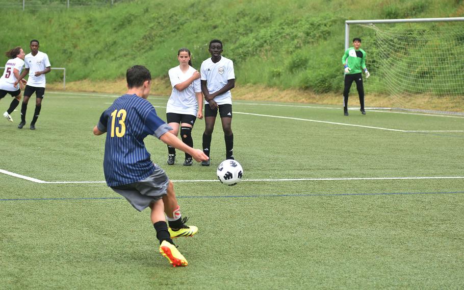 Ansbach’s Daymien Abitua, who scored three times, sends a free kick toward the Baumholder goal Tuesday, May 21, 2024, at the DODEA European Division III boys soccer championships at Landstuhl, Germany.