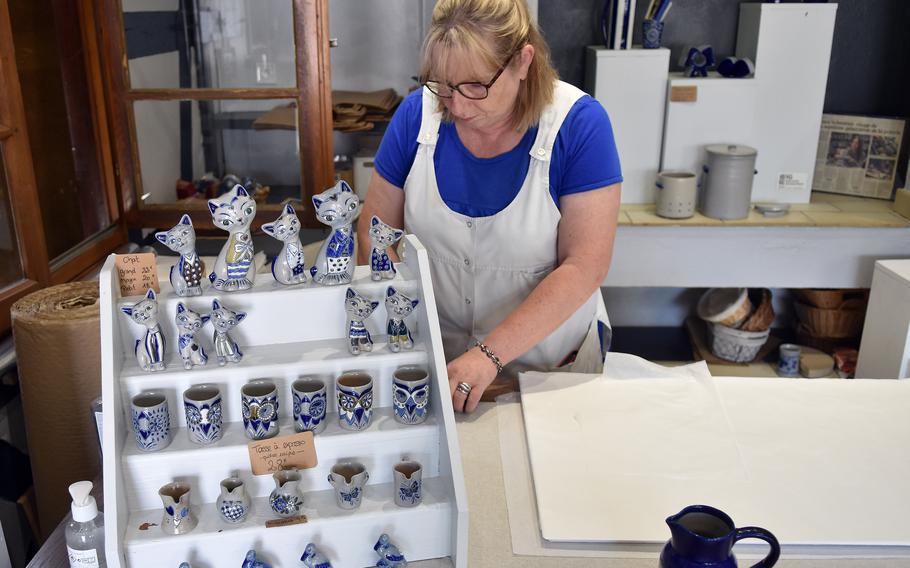 Ceramic cats, storks and owl faces carved into mugs are among some of the unique works found at Fortune Schmitter, a family of potters that has been making gray and blue pottery for seven generations in Betschdorf, France.