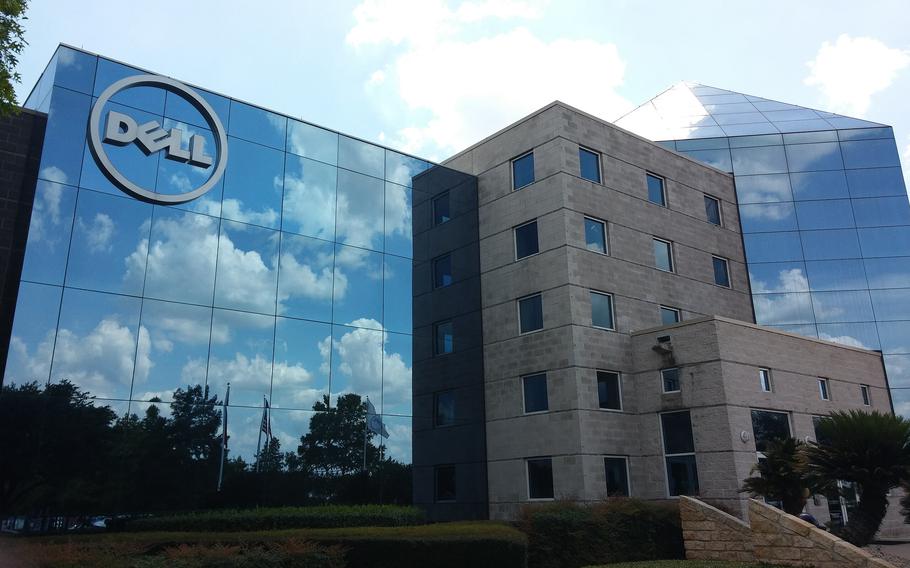 A multistory glass building with a Dell logo in the top left corner.