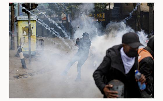 A teargas canister detonates as protesters run for safety during anti-government protests in Nairobi on July 16, 2024. Police were out in force in the centre of Kenya's capital on Tuesday after calls for more demonstrations against the embattled government of President William Ruto. Activists led by young Gen-Z Kenyans launched peaceful rallies a month ago against deeply unpopular tax hikes but they descended into deadly violence last month, prompting Ruto to drop the planned increases. (Tony Karumba/AFP/Getty Images/TNS)