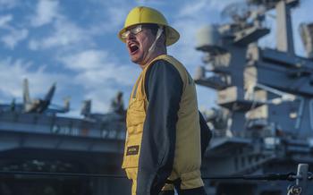 Petty Officer 2nd Class Andrew Harber aboard the USS William P. Lawrence instructs sailors to heave a line from the USS Carl Vinson in a refueling evolution during RIMPAC exercises in Hawaii on July 21, 2024.