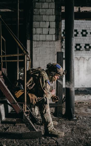 An Alpha unit member smokes a cigarette at the Avdiivka plant.