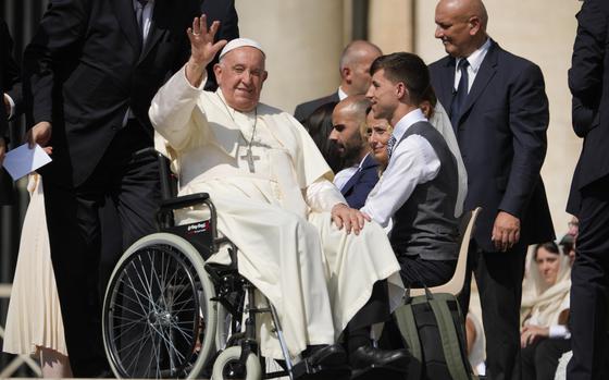 FILE-- Pope Francis waves as he leaves after his weekly general audience in St. Peter's Square at The Vatican, Aug. 28, 2024. (AP Photo/Andrew Medichini, File)