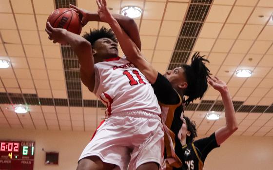 Kinnick's Isaiah Kimbrough goes up to shoot againsts Humphreys.