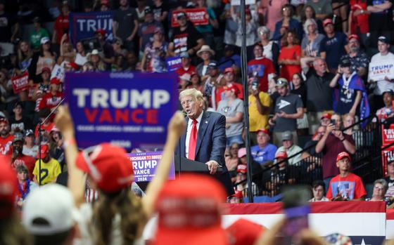 Former president Donald Trump speaks to supporters at a rally in Grand Rapids, Mich., on Saturday.