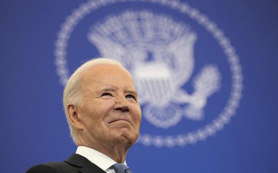 Joe Biden in front of the presidential seal