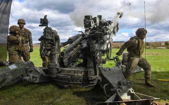 U.S. 2nd Cavalry Regiment soldiers fire an M777 howitzer at Grafenwoehr ...