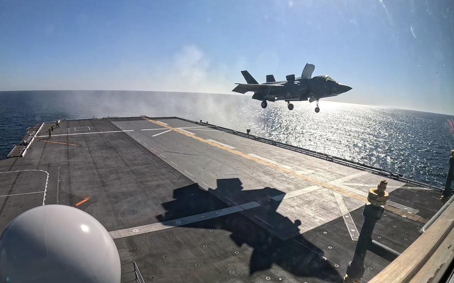 An F-35B Lightning II lands on a Japanese helicopter carrier off California.