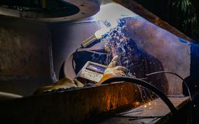 Newport News Shipbuilding contractor Tyquan Young, from New York, welds a bolting ring on the rim of a catapult cover on the flight deck of the aircraft carrier USS John C. Stennis (CVN 74), in Newport News, Virginia, Oct. 5, 2022. The John C. Stennis is in Newport News Shipyard working alongside NNS, NAVSEA and contractors conducting Refueling and Complex Overhaul as part of the mission to deliver the warship back in the fight, on time and on budget, to resume its duty of defending the United States. (U.S. Navy Photo by Mass Communication Specialist 3rd Class Jong S. Park)