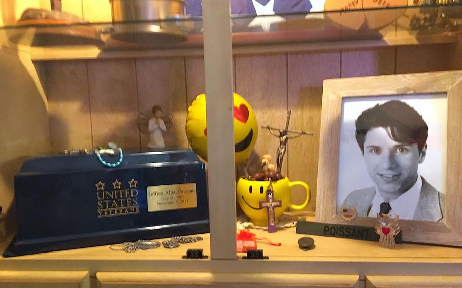Marty Weber maintains a small shrine to his life partner and fellow Army veteran Jeffrey Allen Poissant, who died in 2017.