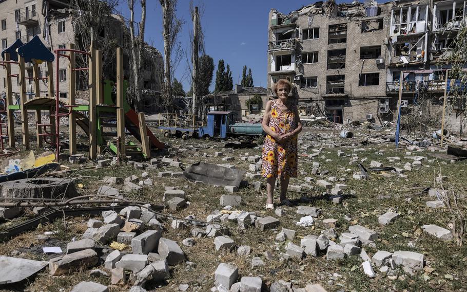 Raisa Rybalchenko, 78, stands among the rubble outside her apartment building in Pokrovsk, Ukraine, on August 9, 2023.