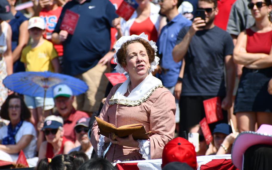 A reenactor portraying Abigail Adams reads the Declaration of Independence on the steps of the National Archives for its July 4, 2024, eevnt.