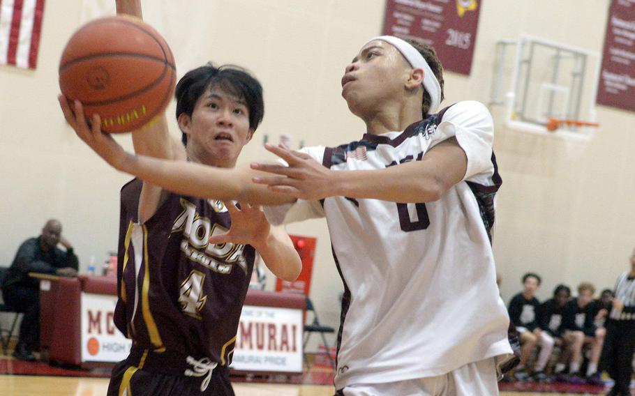 Matthew C. Perry's Jahiion Francois goes up for a shot against Noda Gakuen during Friday's Japan boys basketball game. The Samurai won 57-48.