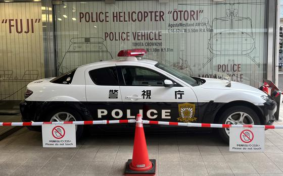 A sport-style Japanese police cruiser displayed outstide the entrance to the Police Museum in Tokyo. 