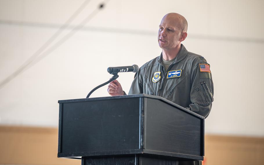 U.S. Air Force Col. Jay Johnson speaks at the decommissioning ceremony for the KC-10 Extender.