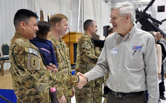 U.S. Army Sgt. Derek Lebeau, with the South Dakota Army National Guard’s Detachment 48, Operational Support Airlift Command, is welcomed home by retired Command Sgt. Maj. Mike Birnbaum during the unit’s welcome home ceremony at the Army Aviation Support Facility, Rapid City, S.D., Jan. 23, 2016. The aviation unit served eight months in Afghanistan in support of Operation Freedom’s Sentinel.