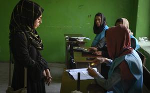 Kabul, Afghanistan, Sep. 28, 2019: Hasiba, 19, prepares to vote in her first presidential election at a polling station in downtown Kabul, Afghanistan, Sept. 28, 2019. It would be the last free elections held in the country before the Taliban took over its rule in August 2021.  

META TAGS: Presidential elections; Afghanistan; Operation Freedom's Sentinel; Wars on Terror; 