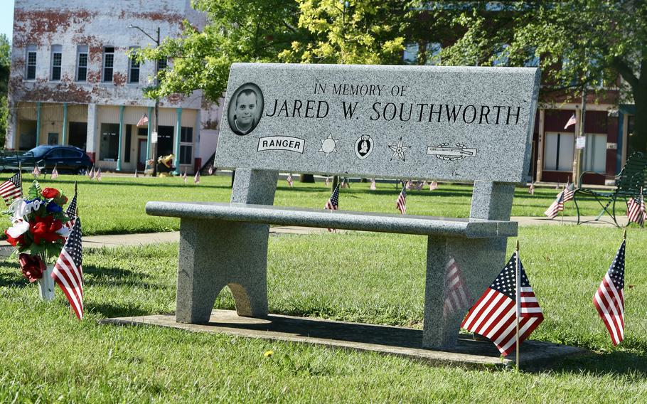 A park bench honoring Jared Southworth sits in the Oakland (Ill.) Town Square. 