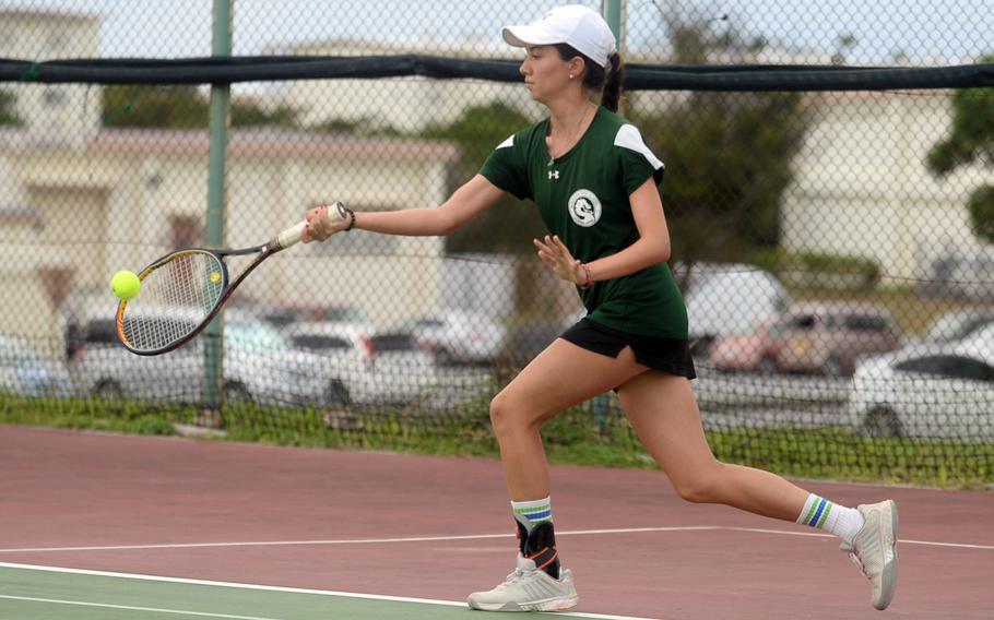 Kubasaki's Lan Legros hits a return during Tuesday's Okinawa tennis singles matches. Legros beat Kadena's Brooke Brewer 6-1.