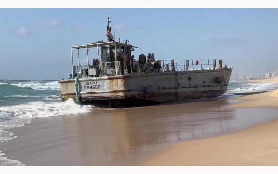 A video screen grab shows a U.S. military vessel that ran aground in Ashdod, Israel, due to heavy seas.
