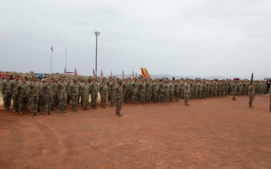 More than 150 service members of the 856th Military Police Company from the Arizona Army National Guard rally together with their families on Bushmaster Field in Phoenix, Ariz., for an send-off ceremony Sunday, Jan. 21, 2024. 